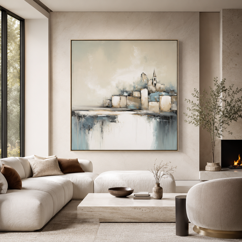 Luxury architectural wall art in a modern neutral living room with a large framed abstract cityscape canvas, elegant stone finishes, soft natural light, and high-end contemporary decor