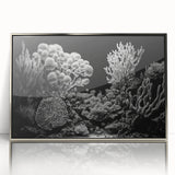 Framed wall art showcasing a vibrant marine life coral design in shades of blue and orange, featuring a sleek silver frame that enhances its modern aesthetic. Perfect for ocean-themed decor.