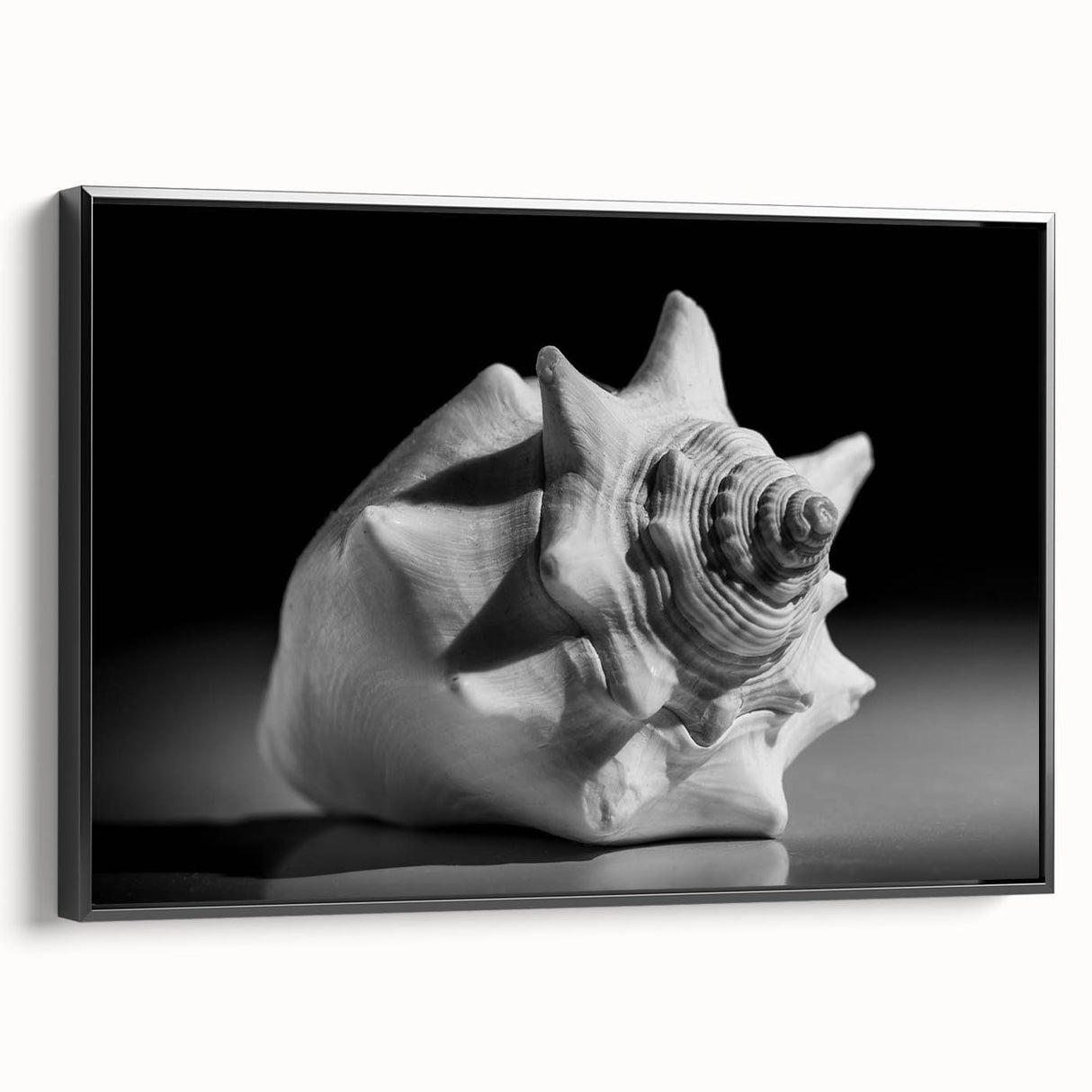 Framed canvas wall art showcasing a vibrant marine life coral design, featuring intricate details in blues and greens, with a sleek black frame, perfect for ocean-themed decor.