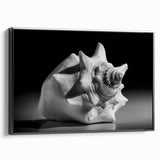 Framed canvas wall art showcasing a vibrant marine life coral design, featuring intricate details in blues and greens, with a sleek black frame, perfect for ocean-themed decor.