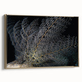 Framed canvas wall art showcasing a vibrant coral reef design with intricate marine life details in gold accents, perfect for coastal-themed decor.