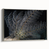 Framed wall art featuring a vibrant coral design in shades of blue and orange, showcasing intricate marine life details, set against a sleek silver frame. Perfect for ocean-themed decor.