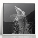 Framed wall art featuring a dolphin design in vibrant marine colors, displayed in a stylish white frame, perfect for ocean-themed decor and nature enthusiasts.