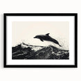 Framed wall art featuring a marine life dolphin design in vibrant colors, set in a sleek black frame with a mat for an elegant display, perfect for ocean-themed decor.