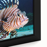 Close-up of a framed canvas wall art depicting vibrant marine life with colorful fish designs, ideal for ocean-themed decor, showcasing intricate details and textures.