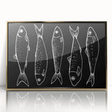 Framed wall art showcasing a vibrant marine life fish design in acrylic with a gold frame, perfect for enhancing coastal-themed home decor.