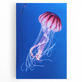 Vibrant jellyfish wall art printed on stretched canvas, showcasing intricate marine life details in soothing blue and purple hues, perfect for ocean-themed decor.