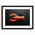 Framed wall art featuring a detailed lobster design in vibrant colors, set against a black mat, ideal for marine life enthusiasts and coastal decor.