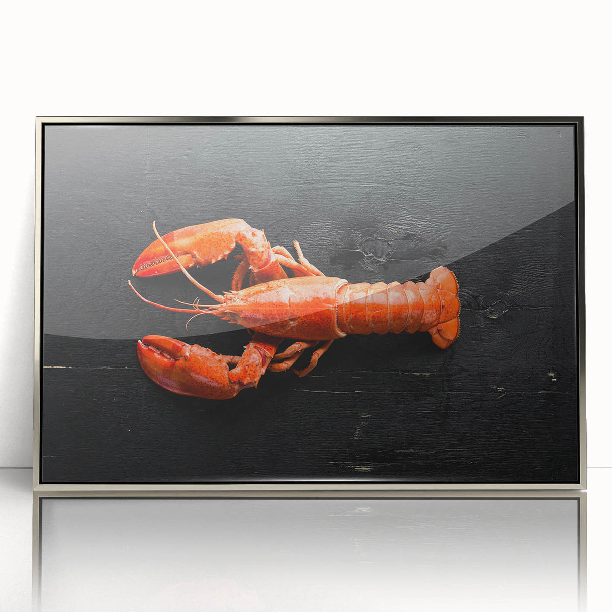 Framed wall art featuring a vibrant marine life design with a detailed lobster illustration, set in an elegant silver frame, ideal for coastal decor enthusiasts.
