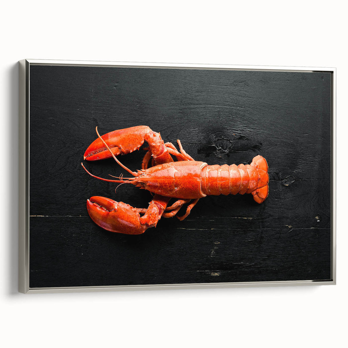 Framed wall art showcasing a detailed silver lobster design on canvas, highlighting intricate textures and vibrant colors, perfect for marine life enthusiasts.