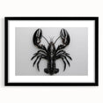 Framed wall art showcasing a vibrant marine life lobster design, featuring a black frame and mat, perfect for ocean-themed home decor. Ideal for seafood lovers.