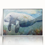 Framed wall art featuring a vibrant manatee design, showcasing marine life in vivid colors, with a sleek white frame and acrylic finish for a modern touch. Perfect for ocean-themed decor enthusiasts.