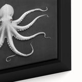 Close-up view of a framed canvas wall art depicting a vibrant octopus design, showcasing detailed marine life colors and textures, perfect for ocean-themed decor.