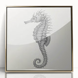 Framed wall art featuring an elegant gold-accented seahorse design, showcasing intricate marine life details on a vibrant background, perfect for coastal decor.