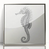 Framed wall art piece showcasing a vibrant seahorse design, featuring an acrylic finish and a sleek silver frame, perfect for marine-themed decor.