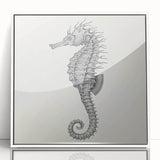 Framed wall art showcasing a vibrant marine life design featuring a seahorse, set in a sleek white frame, perfect for ocean-themed decor.