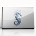 Framed wall art featuring a vibrant seahorse design in an acrylic finish, showcasing intricate marine life details against a sleek black background. Perfect for ocean-themed decor.