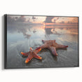 Framed canvas wall art showcasing a vibrant starfish marine life design, featuring a sleek black frame and side view, perfect for coastal-themed decor.