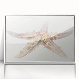 Framed wall art featuring a vibrant starfish design in marine life theme, set against a white background, ideal for coastal decor enthusiasts.