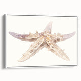Framed canvas wall art showcasing a vibrant starfish design in marine life theme, with a white frame, perfect for coastal decor and beach-inspired interiors.