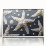 Framed wall art featuring a vibrant starfish design in shades of blue and orange, set against a clean white background, perfect for marine-themed decor.