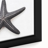Close-up of a framed canvas wall art piece showcasing a vibrant starfish design, featuring intricate textures and vivid marine colors, perfect for coastal decor.