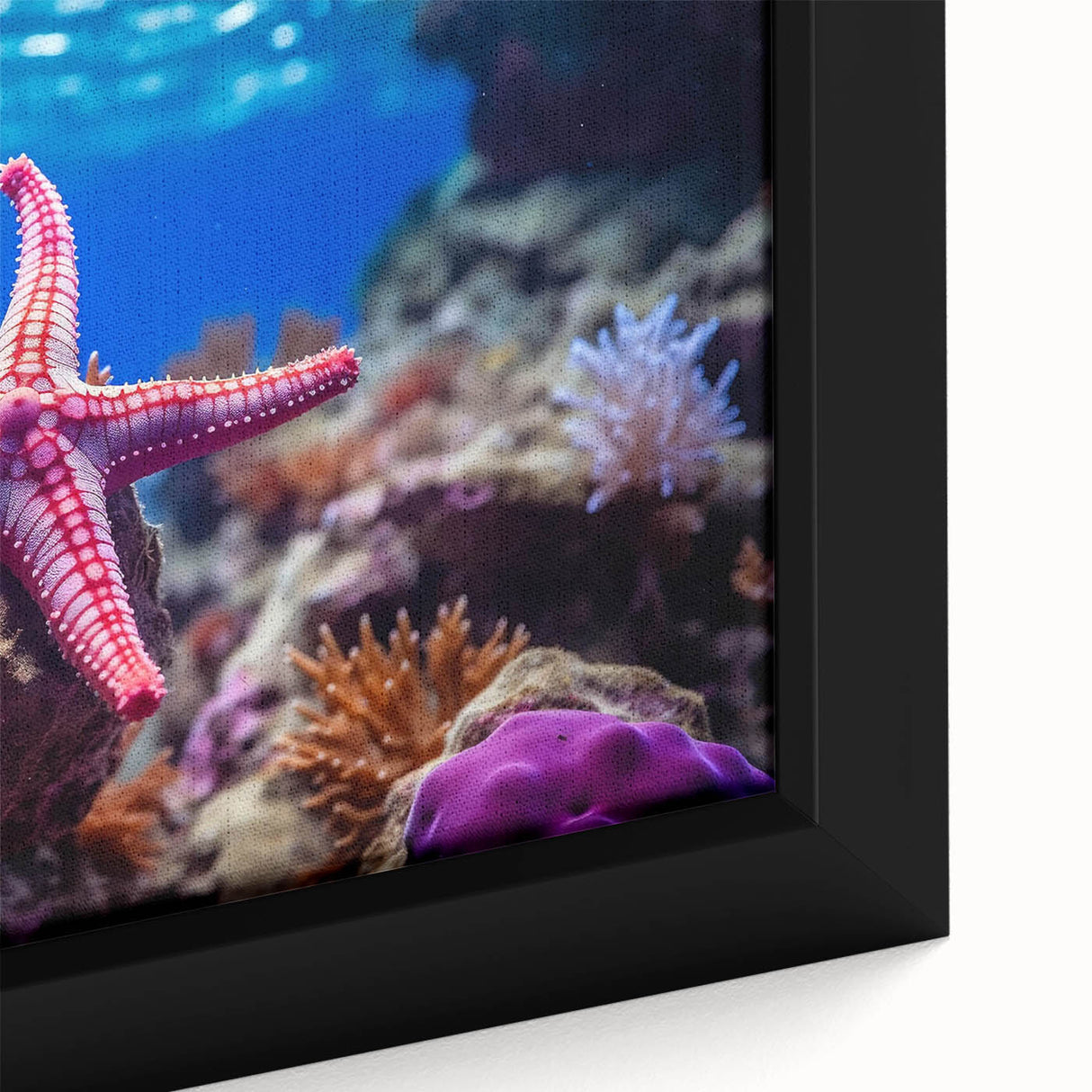 Close-up of a framed canvas wall art piece showcasing a vibrant starfish design, featuring intricate details and bright colors, perfect for marine-themed decor.