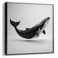 Framed wall art featuring a striking marine life design of a whale against a black background, ideal for ocean-themed decor in contemporary settings.