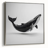 Framed wall art showcasing a silver marine life design featuring a majestic whale, set against a serene ocean backdrop, perfect for coastal decor enthusiasts.
