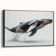 Framed canvas wall art featuring a beautifully illustrated whale design in shades of blue and gray, set against a sleek black frame, perfect for marine life enthusiasts.
