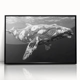 Framed acrylic wall art showcasing a striking marine life design featuring a whale, set against a black background, perfect for ocean-themed decor.