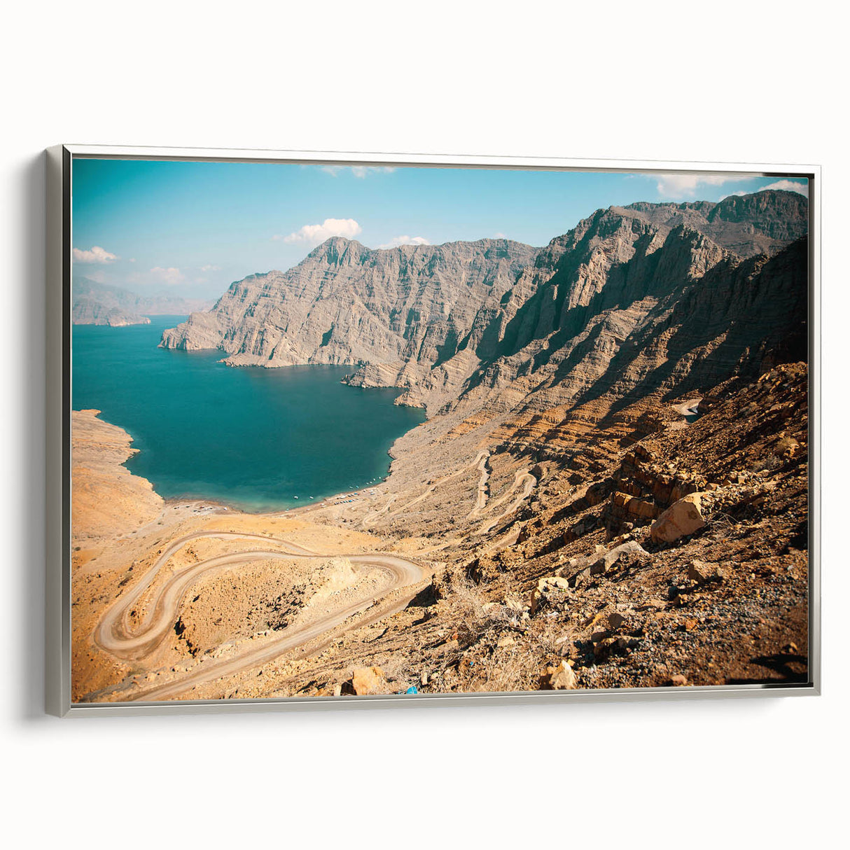 Framed canvas of a vintage-style Middle Eastern landscape in muted silver and black tones, suitable for office decor.