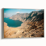 Framed canvas of a vintage-style Middle Eastern landscape in muted silver and black tones, suitable for office decor.