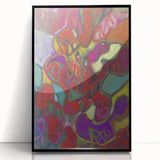 Large abstract wall art featuring dynamic geometric shapes in bold colors, framed in black acrylic.