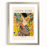 Textured abstract art print of Gustav Klimt's design in a silver frame, featuring swirling golden patterns.