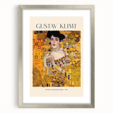 Textured abstract art print featuring swirls in gold and black, framed in silver, ideal for bedroom art.