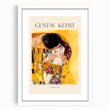 Abstract art print featuring swirling golden patterns on canvas, framed in white, suitable for bedroom or dining room decor.