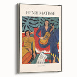 Vintage poster art by Henri Matisse, featuring colorful abstract figures on a black background, framed in silver.