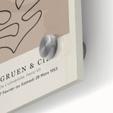 Mid-century modernist art featuring abstract shapes in vibrant colors on acrylic glass, suitable for dining room decor.