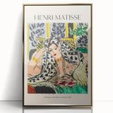 Mid-century modernist art by Henri Matisse, featuring abstract figures in bold colors, framed in acrylic with a gold finish.