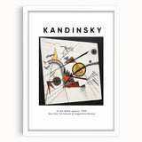 Abstract art print featuring swirling shapes in vibrant primary colors on a white framed canvas.