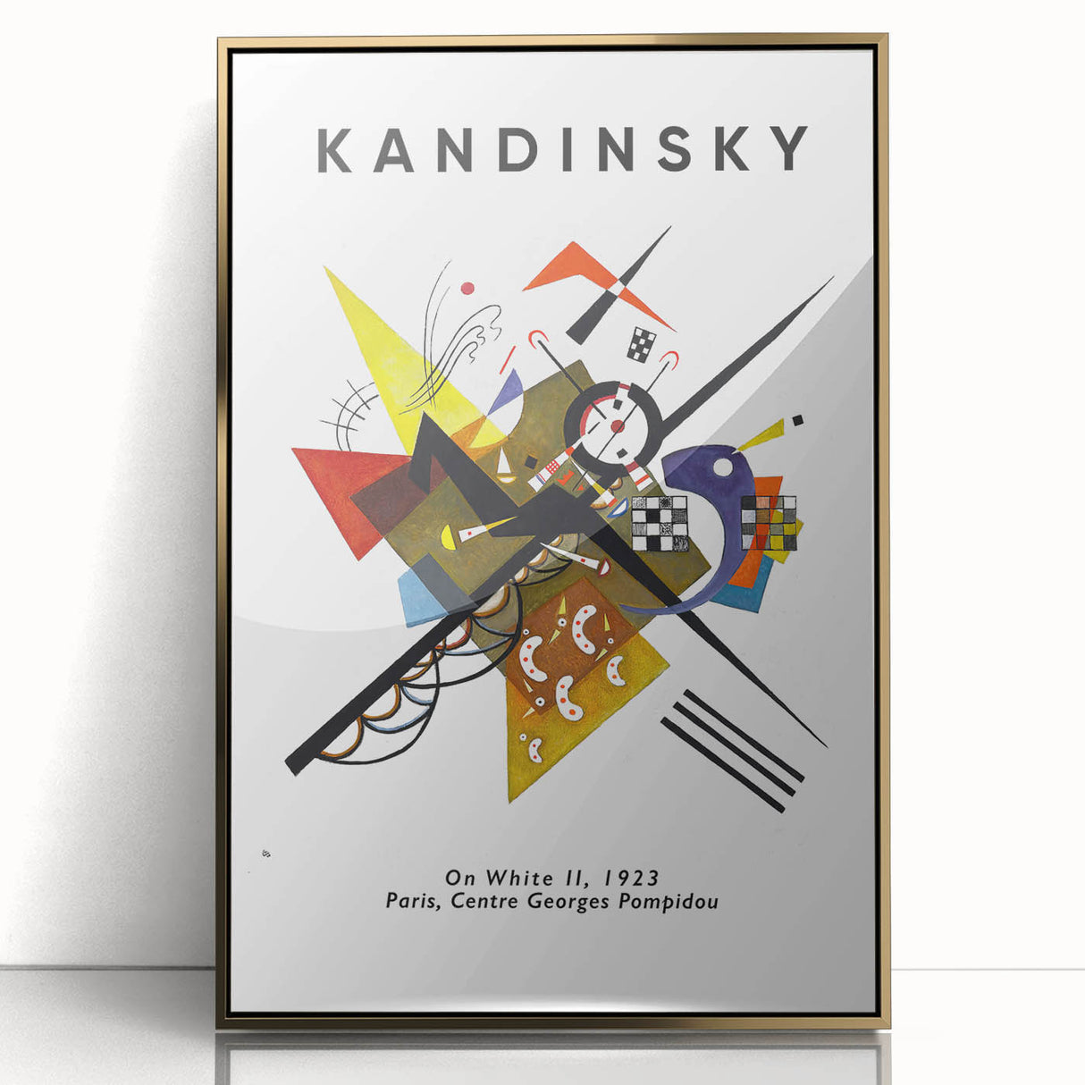 Mid-century modernist art depicting abstract shapes in vibrant colors on a gold-framed acrylic print.