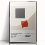 Mid-century modernist art featuring abstract geometric shapes in black and white on a silver-framed acrylic print.