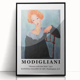 Large abstract wall art featuring a Modigliani-inspired face in muted earth tones, framed in black acrylic.