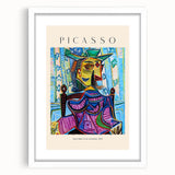 Abstract art print featuring geometric shapes in bold primary colors on white framed canvas.