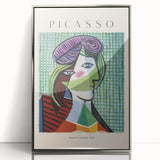 Mid-century modernist art featuring abstract shapes in muted earth tones on a silver-framed acrylic print.
