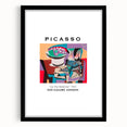 Abstract art print with vibrant, colorful textures on a large canvas, framed in black, ideal for living room decor.