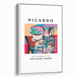 Vintage poster art featuring a Picasso-inspired abstract design in colorful tones on a large framed canvas.