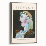 Framed canvas featuring a colorful, abstract landscape with black and vibrant hues.