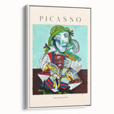 Vintage poster art featuring a Picasso-inspired abstract design in vibrant colors on a framed canvas.